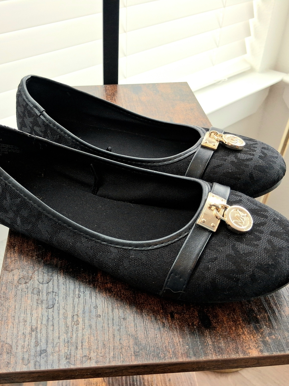 Michael Kors Black Logo Ballet Flats with Gold Medallion